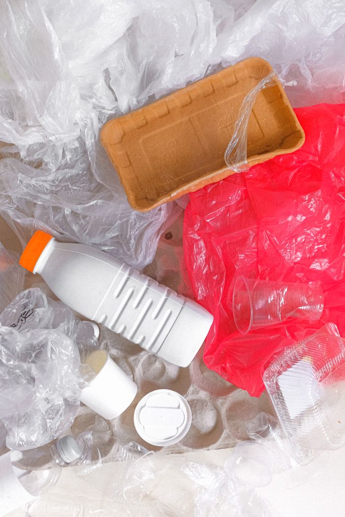 Crafting Captivating Headlines: Your awesome post title goes here Overhead view of mixed plastic waste for recycling awareness.
