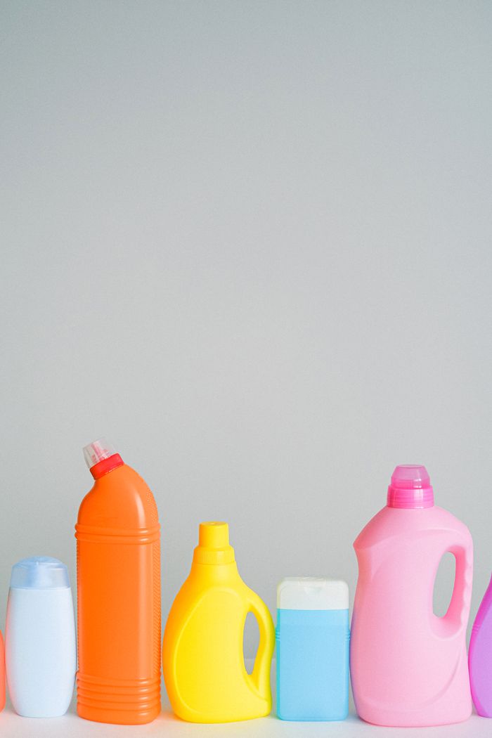 The Art of Drawing Readers In: Your attractive post title goes here Set of assorted multicolored bottles with cleaning detergents for household routine placed on table against white wall in light room